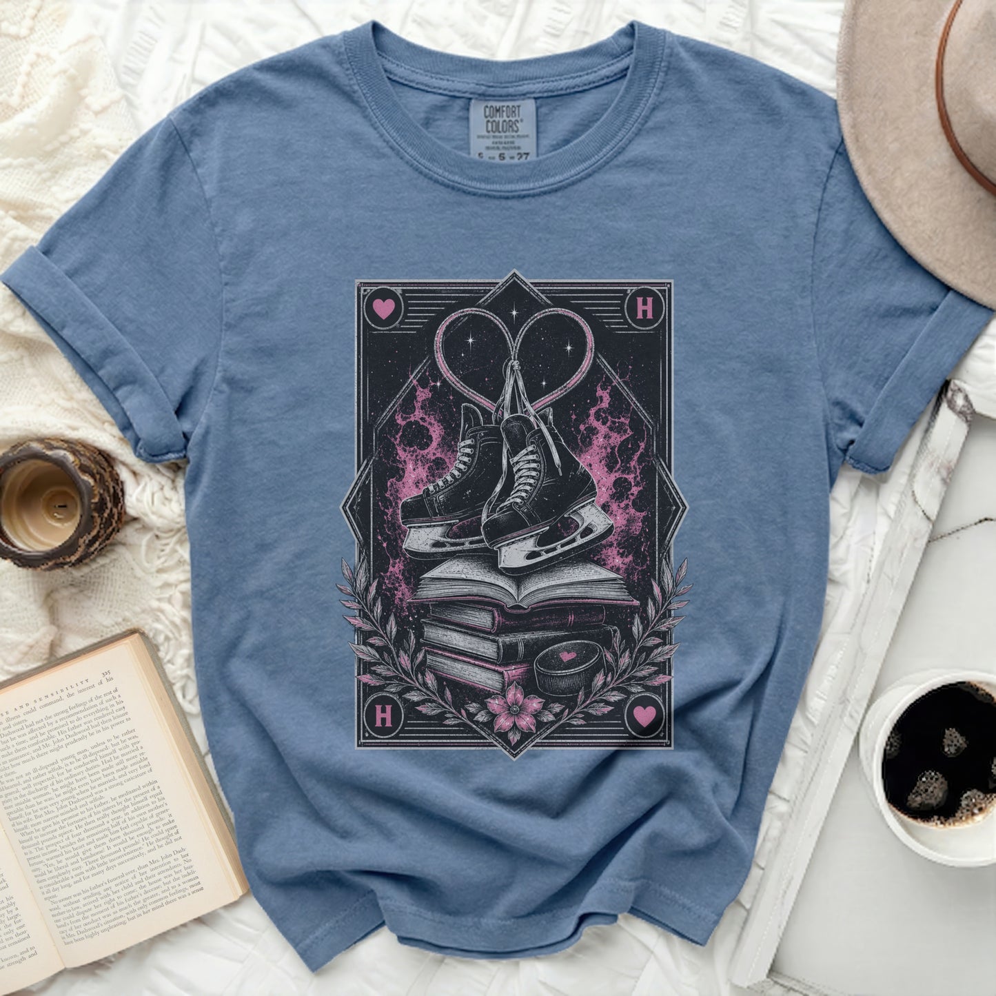 Ice skates and heart design on a blue t-shirt with text "COMFORT COLORS".