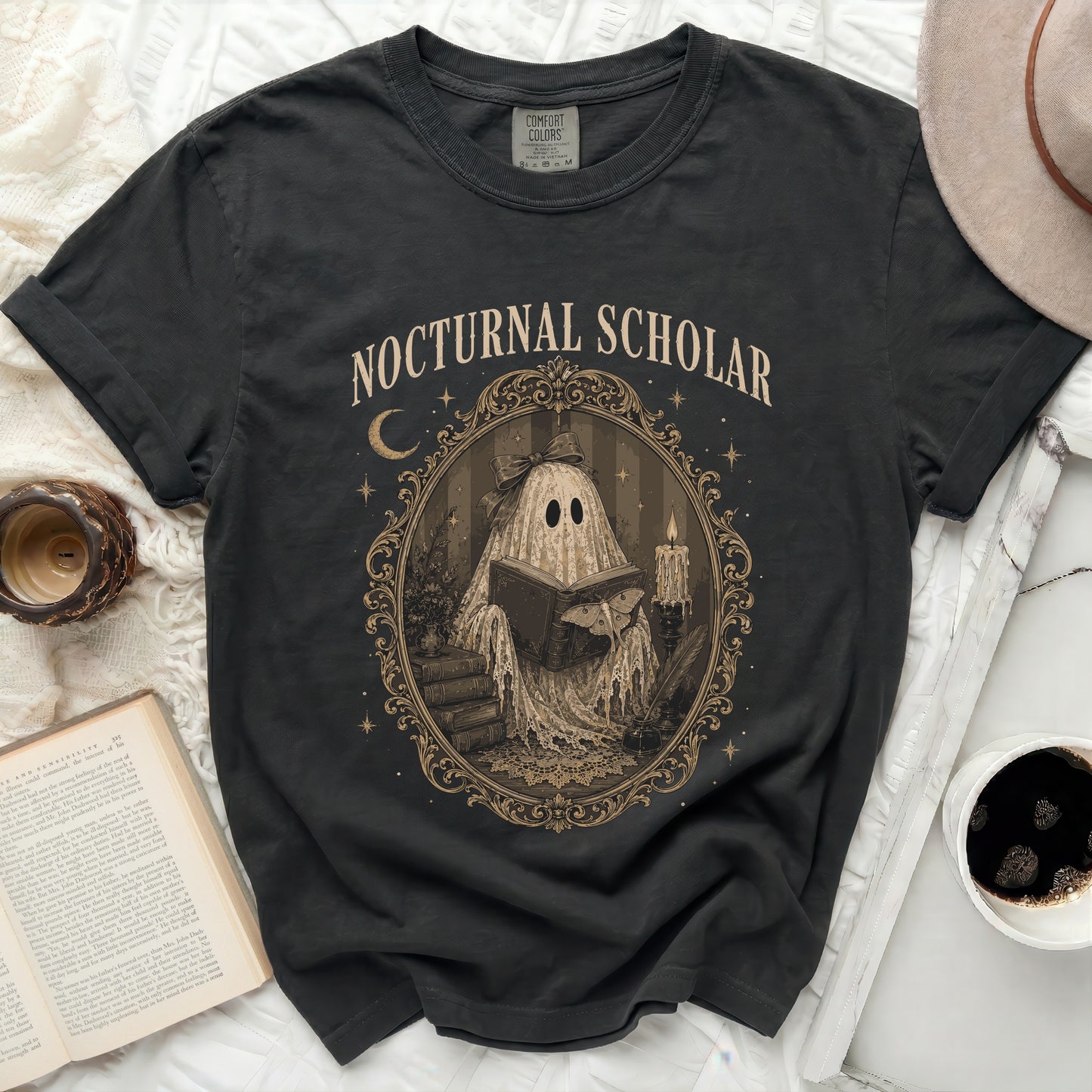 Dark t-shirt with ghost reading book in ornate frame graphic and text.