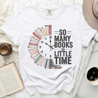 White t-shirt with "So Many Books So Little Time" text design shaped like a clock.
