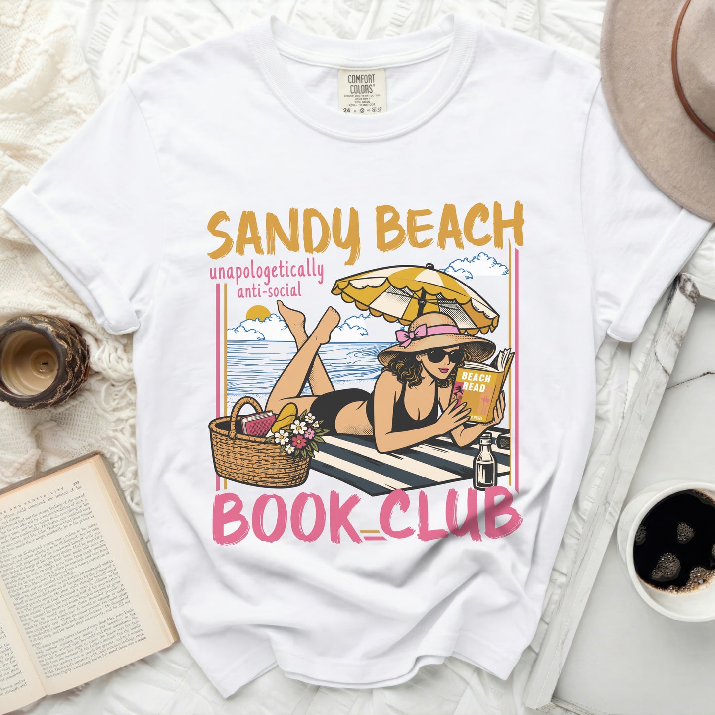White t-shirt with "Sandy Beach Unapologetically Anti-Social Book Club" graphic.