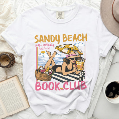White t-shirt with "Sandy Beach Unapologetically Anti-Social Book Club" graphic.