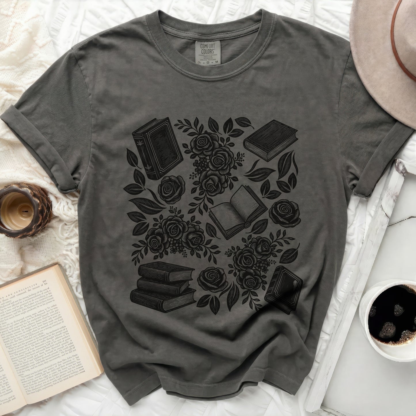 Dark gray t-shirt with a black graphic of books and roses.