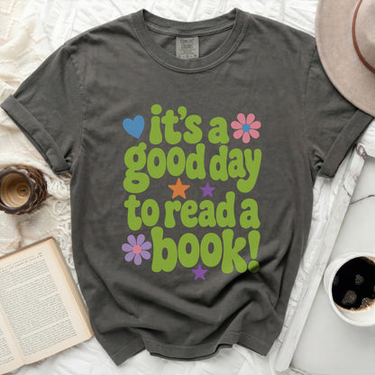 T-shirt with "it's a good day to read a book!" text and graphics.