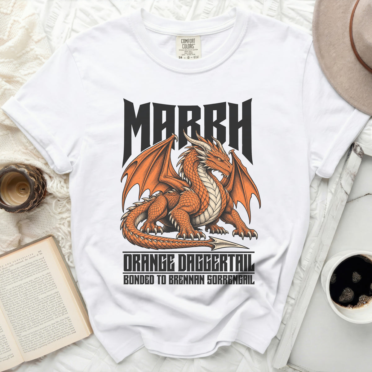 White t-shirt with an orange dragon graphic, "MARRH" and "ORANGE DAGGERTAIL" text.