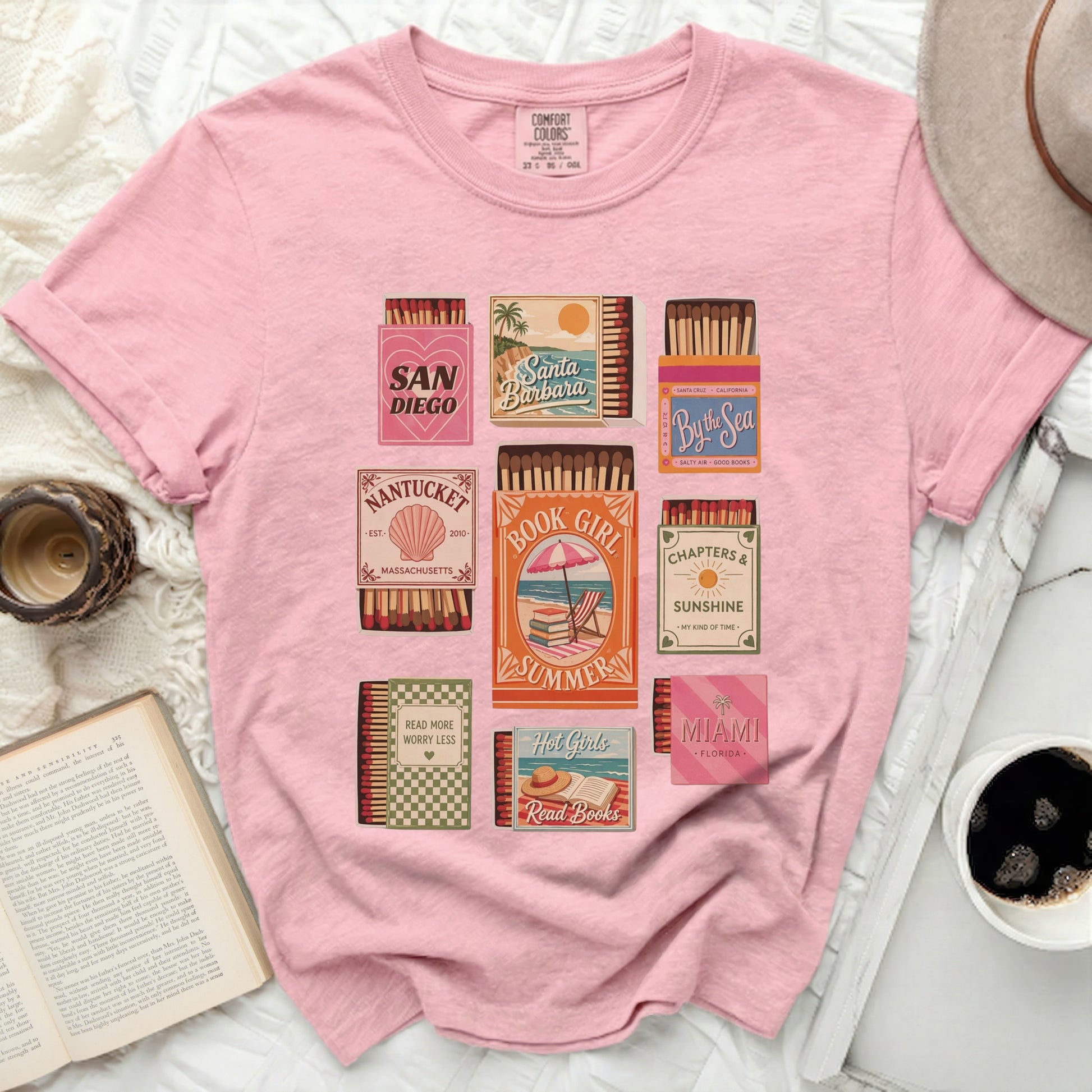 Pink t-shirt with vintage matchbox designs for Book Girl, Summer, and coastal towns.