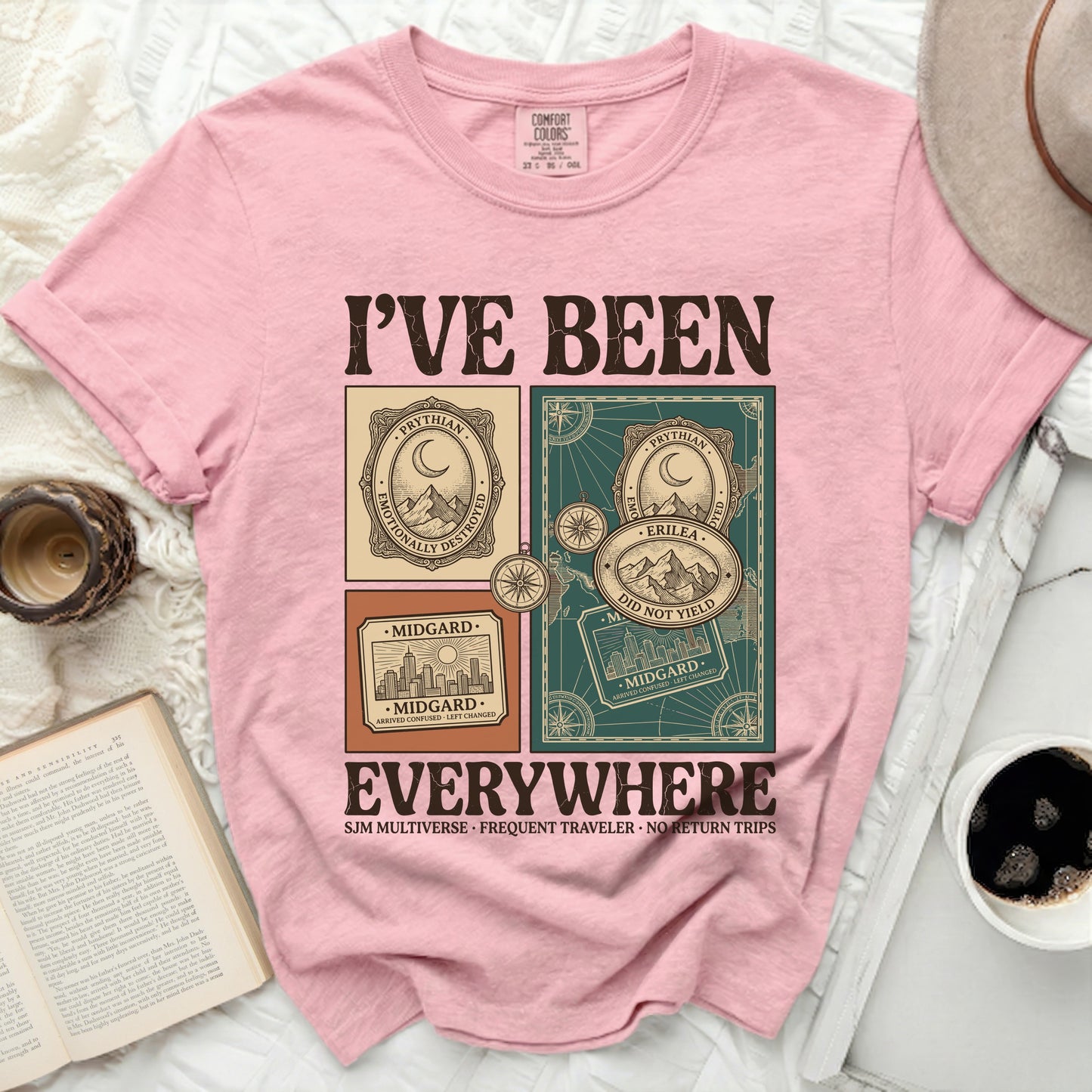 Pink t-shirt with "I'VE BEEN EVERYWHERE" graphic and travel stamps.