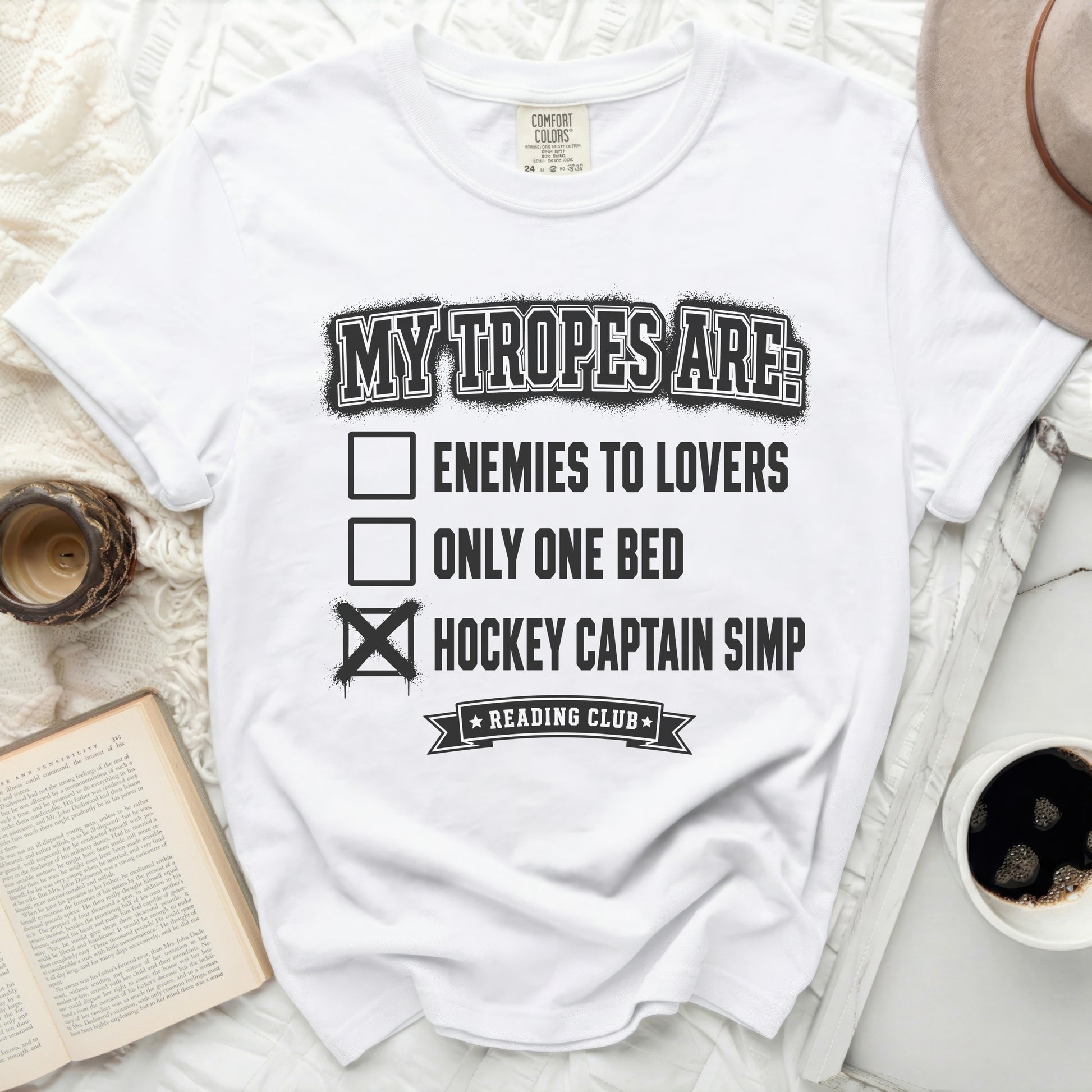 White t-shirt with "My Tropes Are:" and list of tropes including "Hockey Captain Simp."