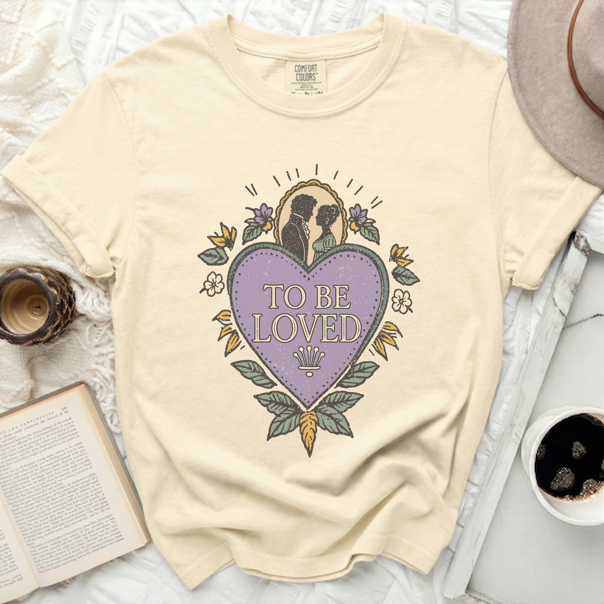 Comfort Colors t-shirt with "To Be Loved" graphic and couple silhouette.