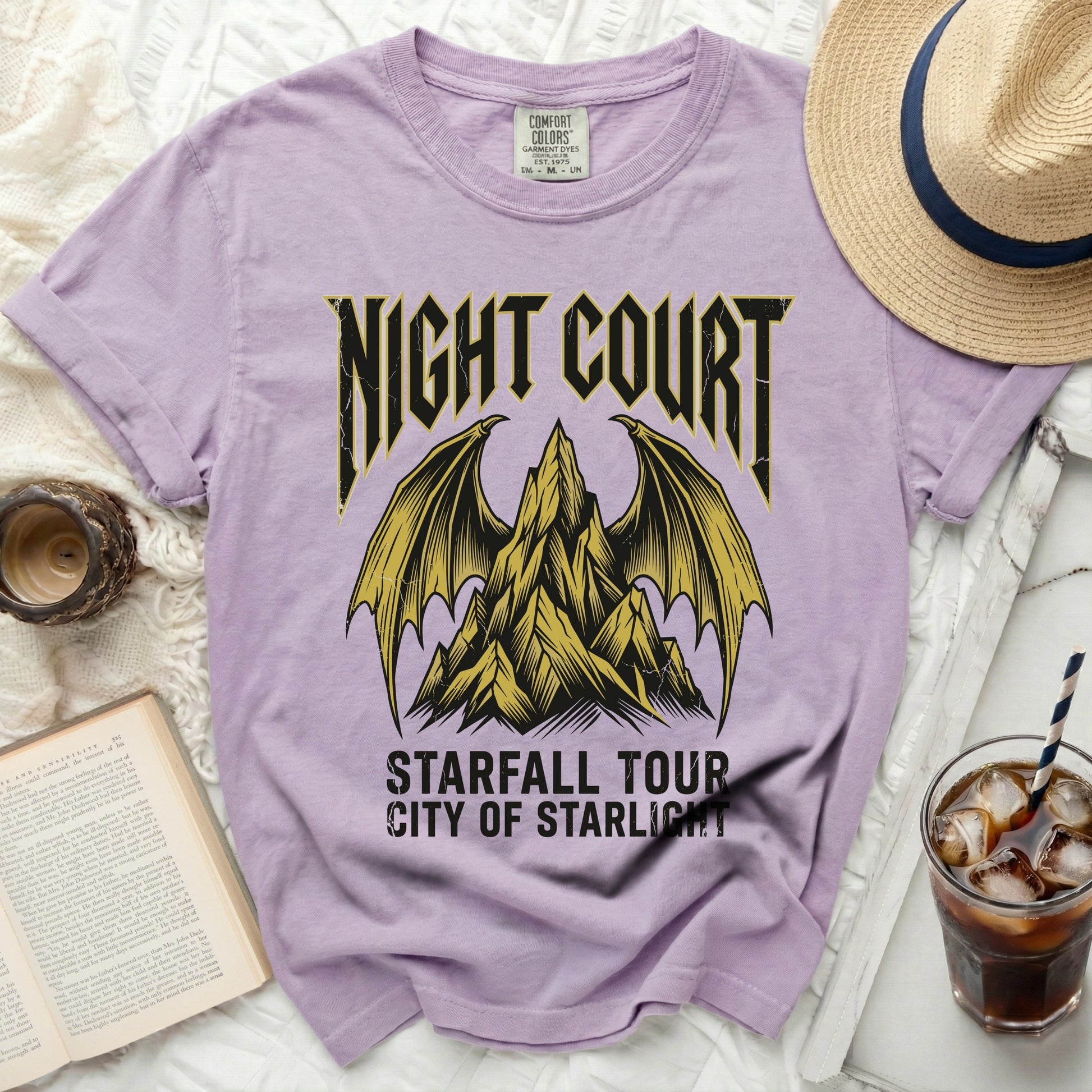 Purple t-shirt with "Night Court Starfall Tour City of Starlight" graphic.
