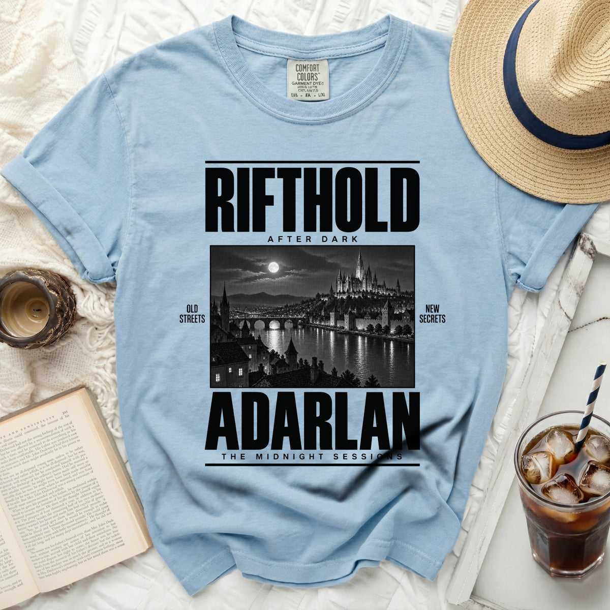 Light blue t-shirt with "RIFTHOLD AFTER DARK" and "ADARLAN THE MIDNIGHT SESSIONS" text.