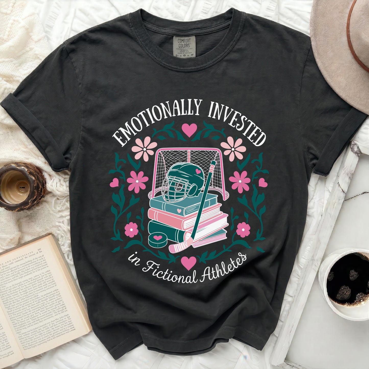 Black t-shirt with "Emotionally Invested in Fictional Athletes" text and hockey graphic.