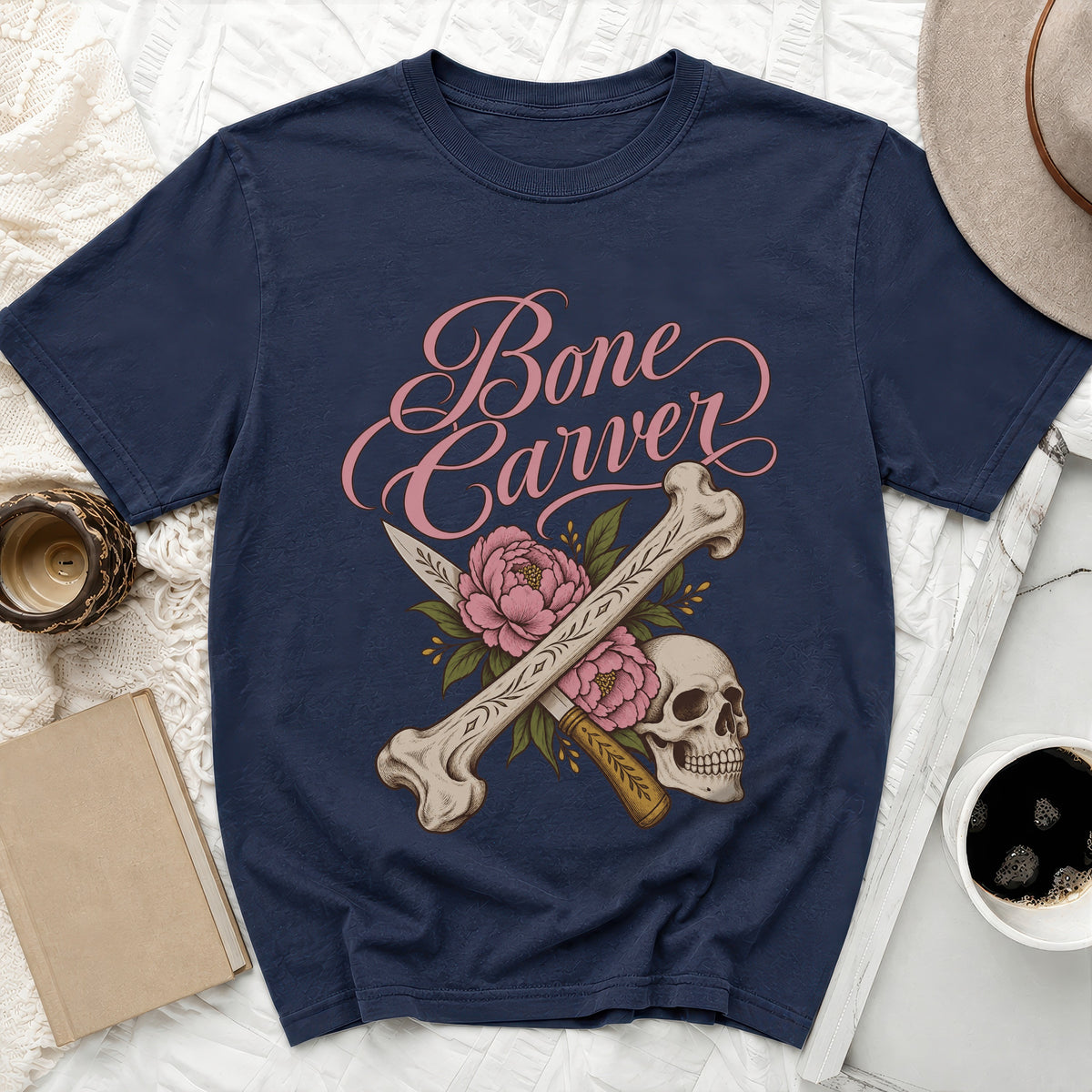 Navy t-shirt with "Bone Carver" text, skull, bones, and pink flowers.