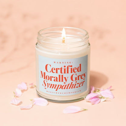 Candle with label "Certified Morally Grey Sympathizer" and "MagicMerchEmporium" text.