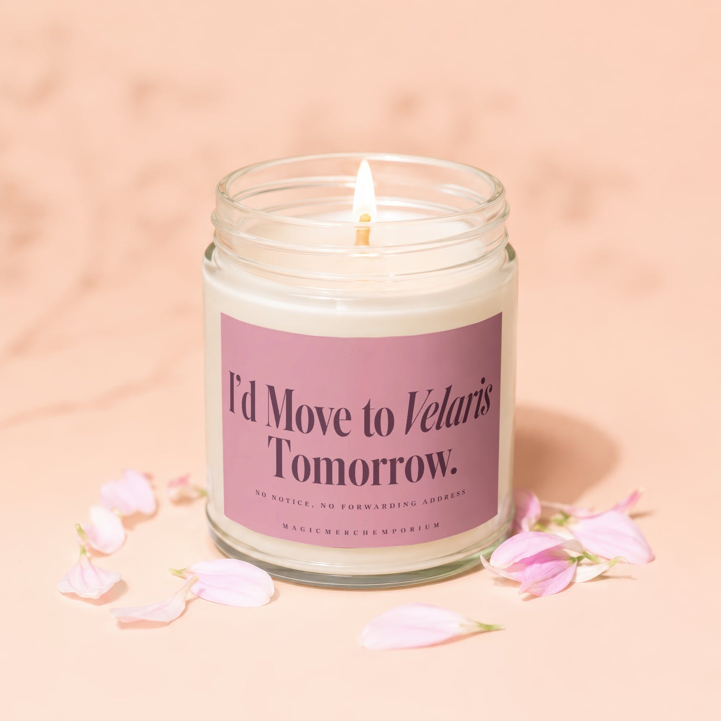 Candle with lit wick and label reading "I'd Move to Velaris Tomorrow."
