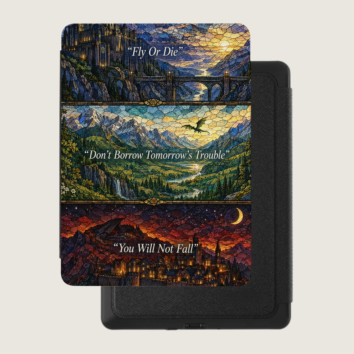 A black e-reader case features a three-panel stained glass fantasy design with castles, dragons, and quotes.