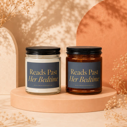 Two candles with "Reads Past Her Bedtime" text on navy labels sit on pedestals.