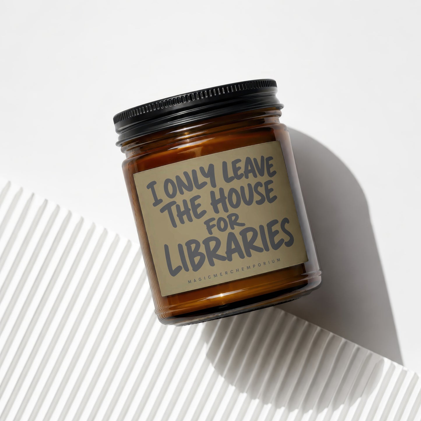 Amber candle with "I ONLY LEAVE THE HOUSE FOR LIBRARIES" text.