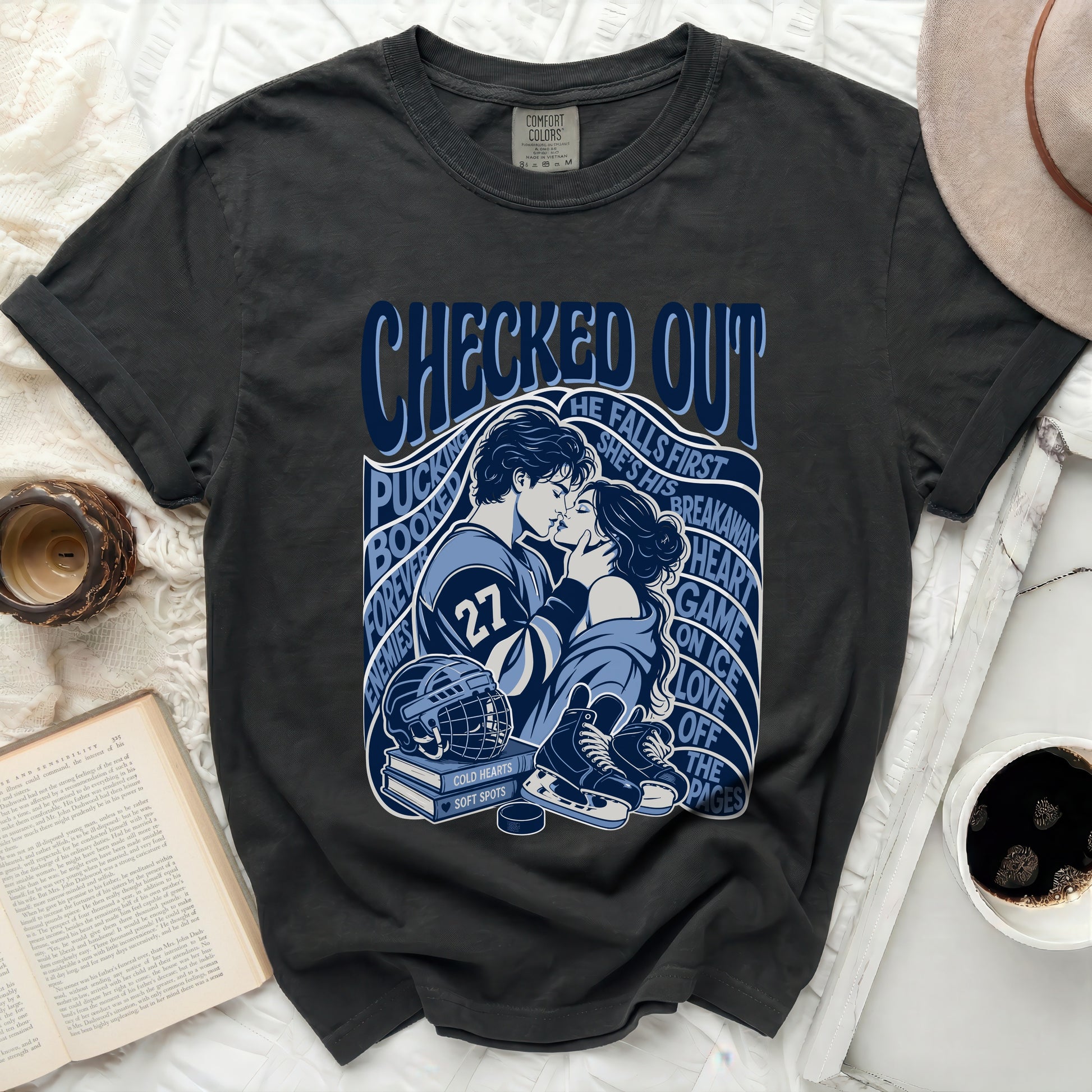 Dark t-shirt with "Checked Out" text, hockey players, and book pages.