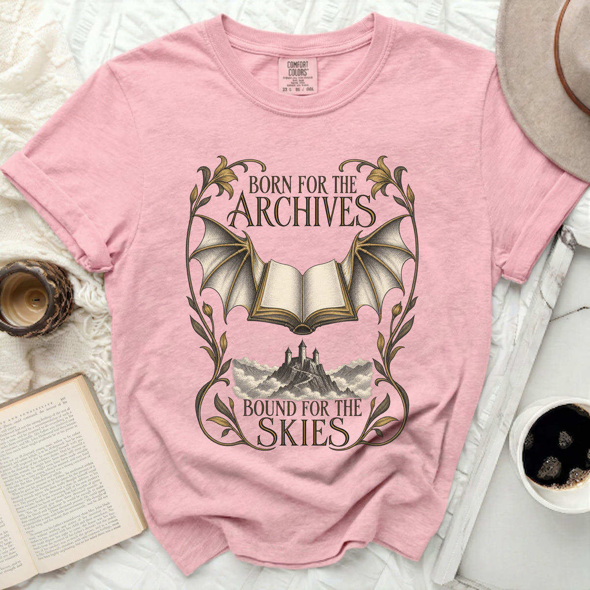 Pink t-shirt with "Born for the Archives" and "Bound for the Skies" text.
