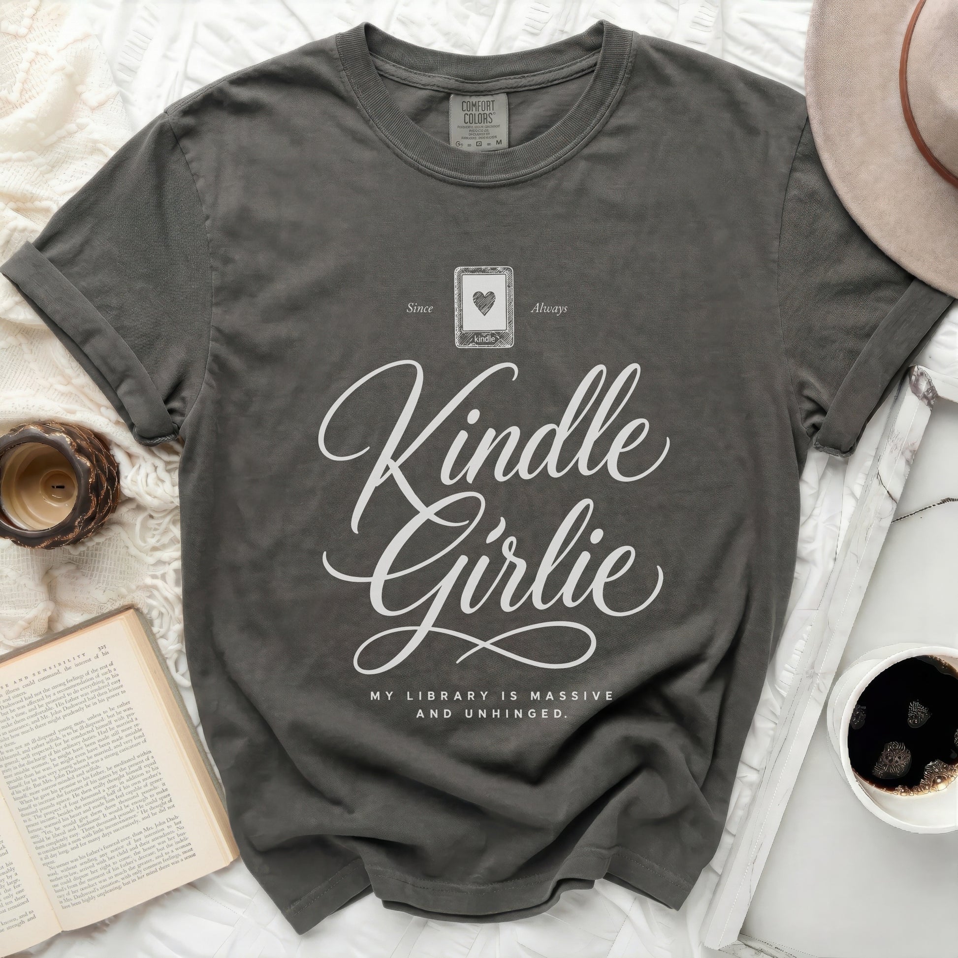 Charcoal t-shirt with "Kindle Girlie" and text about a massive library.
