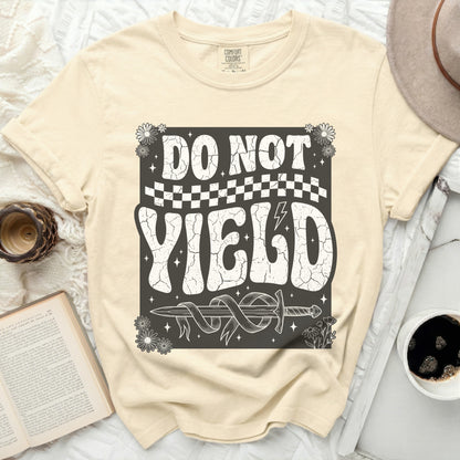 Light yellow t-shirt with "DO NOT YIELD" and a sword graphic.