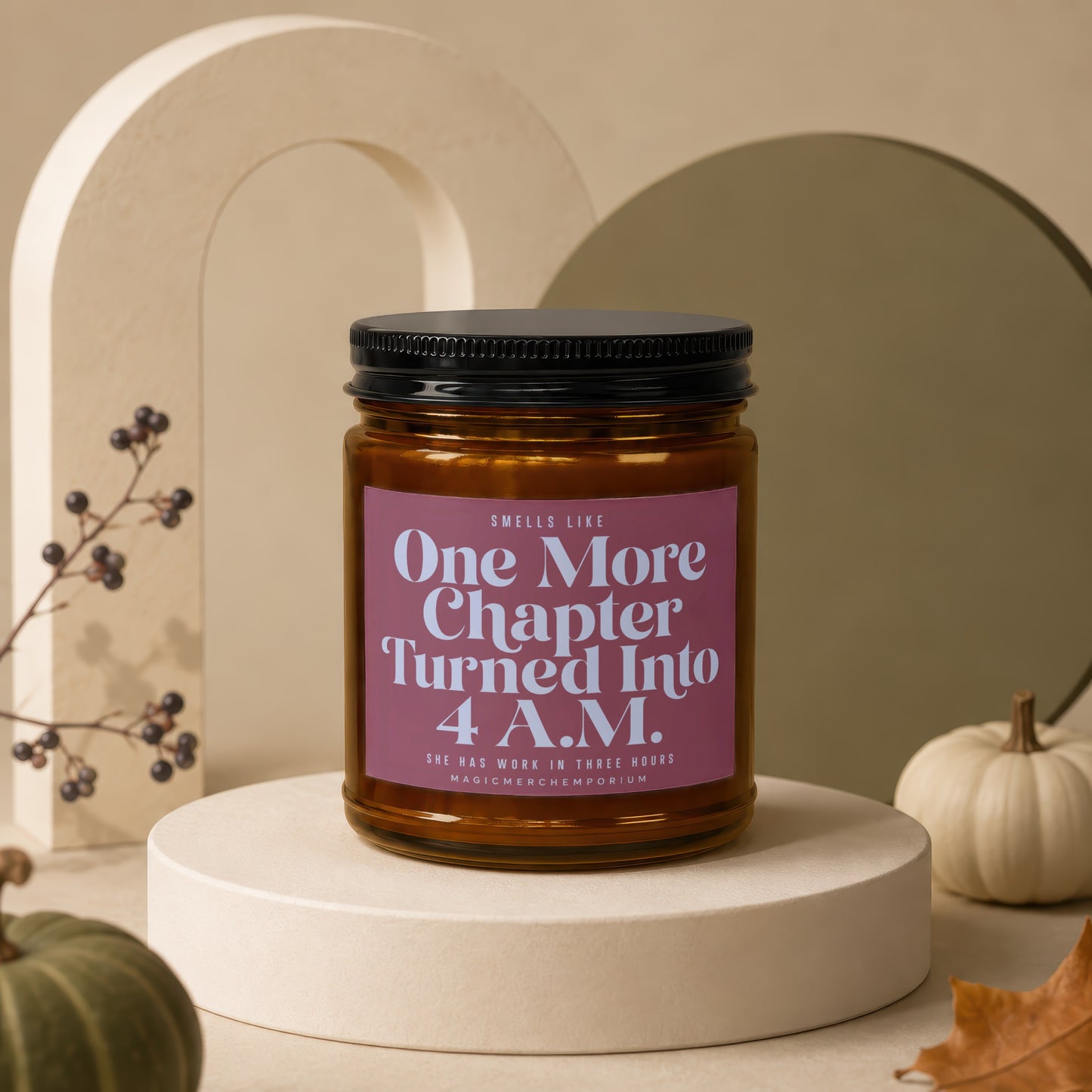 Amber jar candle with pink label reading "One More Chapter Turned Into 4 A.M."