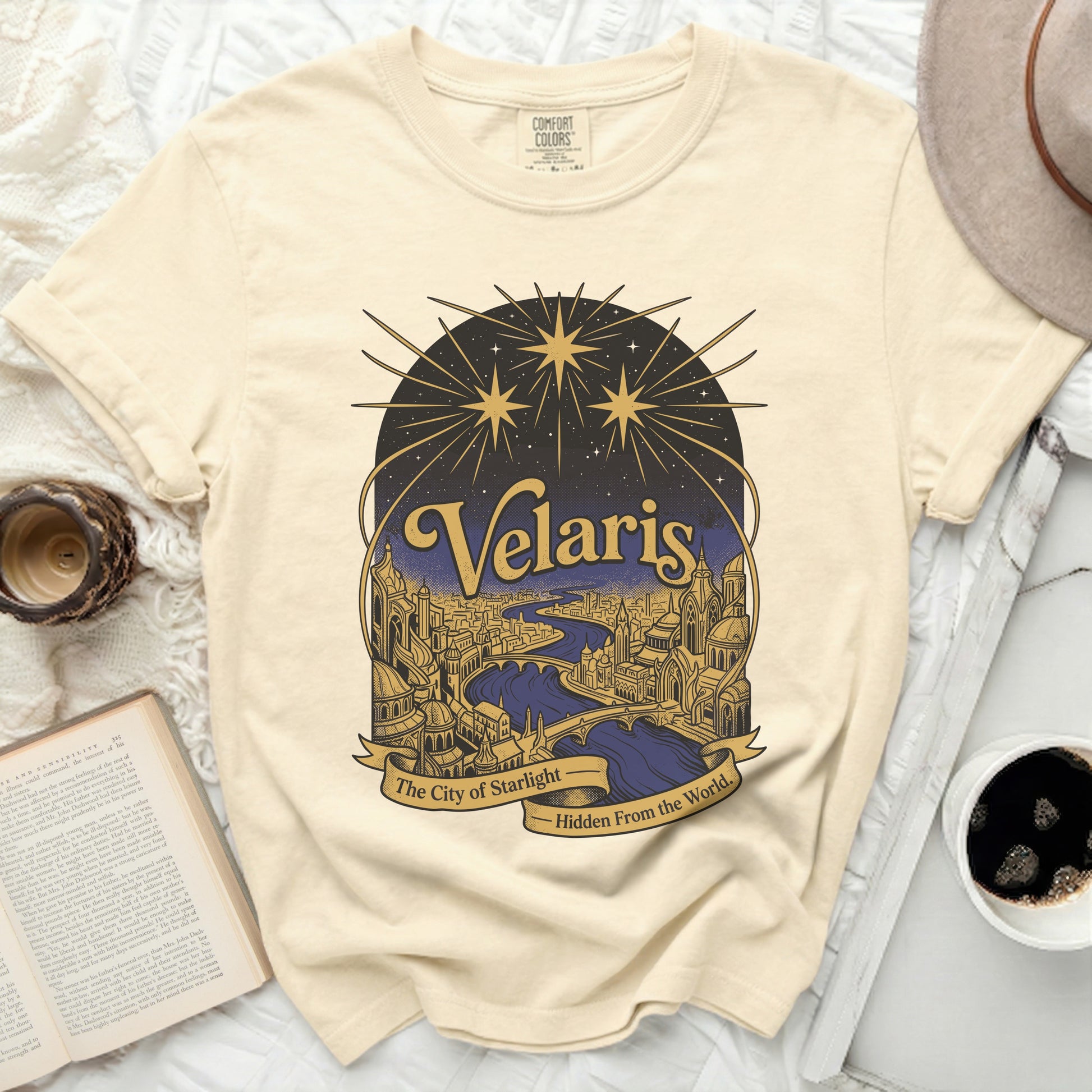 Cream t-shirt with Velaris The City of Starlight graphic.