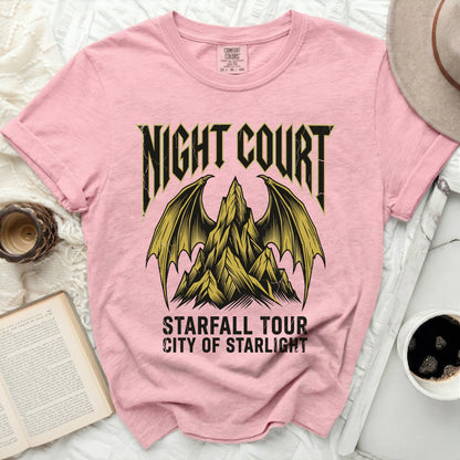 Pink t-shirt with "Night Court Starfall Tour City of Starlight" text and winged mountain graphic.