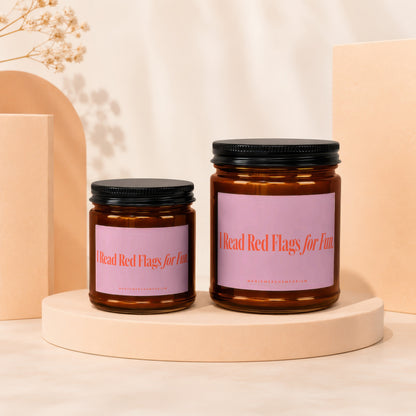 Two amber jars with black lids display pink labels that read "I Read Red Flags for Fun."