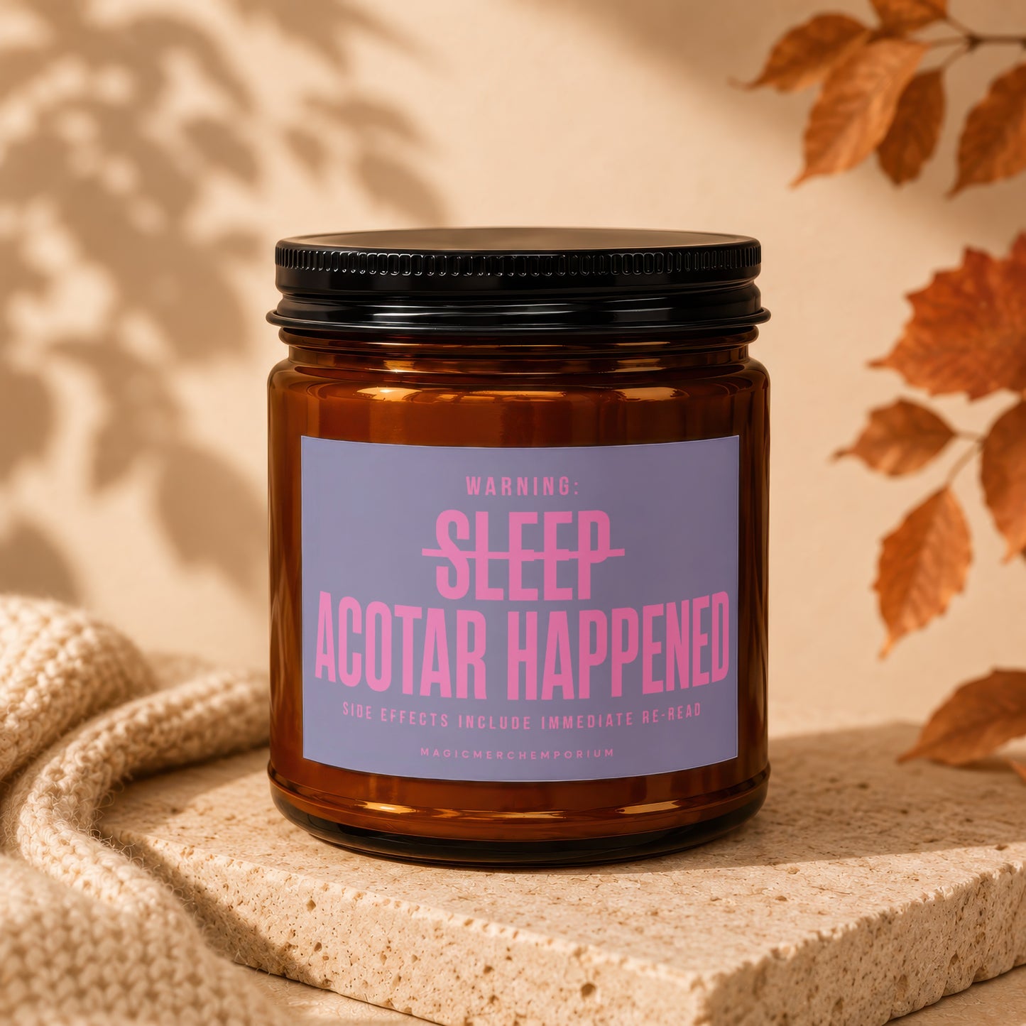 Amber jar candle with lavender label reading "WARNING: SLEEP ACOTAR HAPPENED SIDE EFFECTS INCLUDE IMMEDIATE RE-READ".