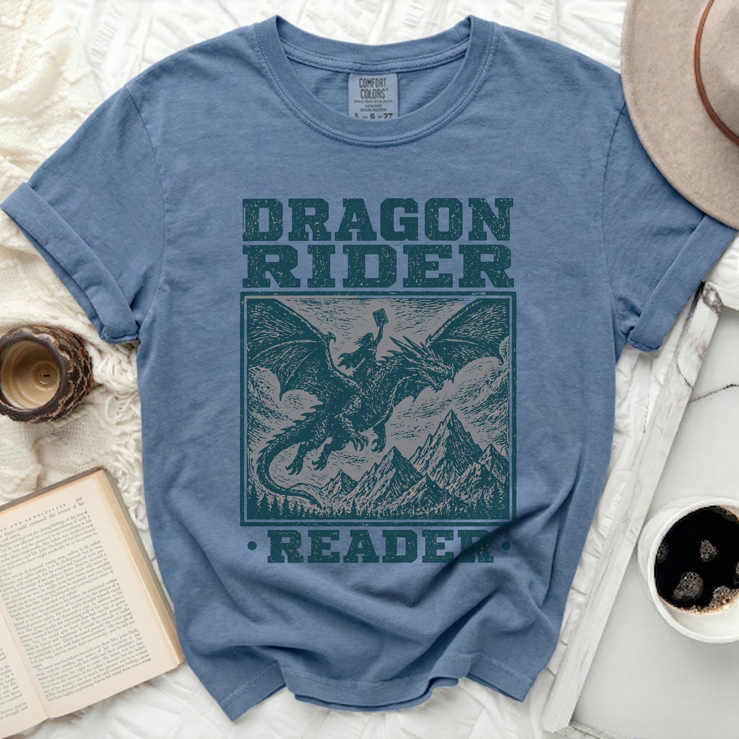 Blue t-shirt with "DRAGON RIDER READER" in distressed text.