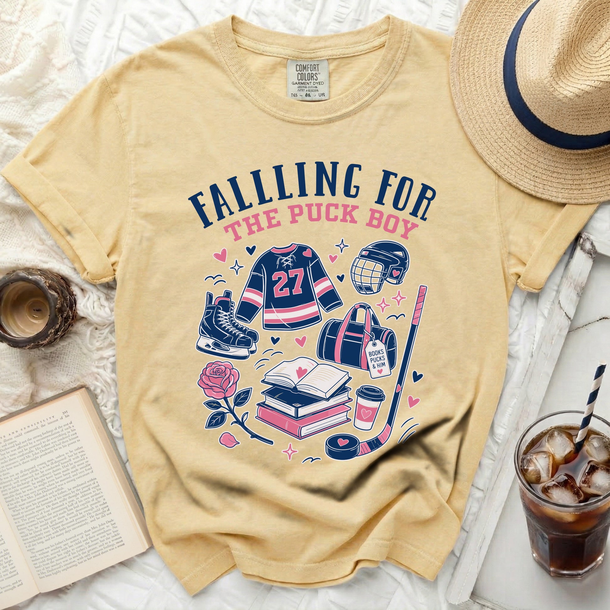 Yellow t-shirt with hockey graphics and "Falling for the Puck Boy" text.