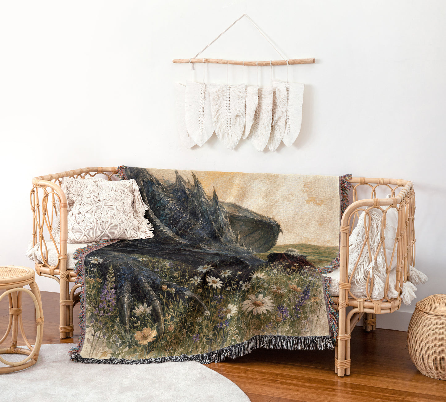 a cozy living room with a wicker bench, a woven basket, and a woven rug. The bench is adorned with a blanket that depicts a mountain landscape, and a wall hanging with white feathers is displayed above it.