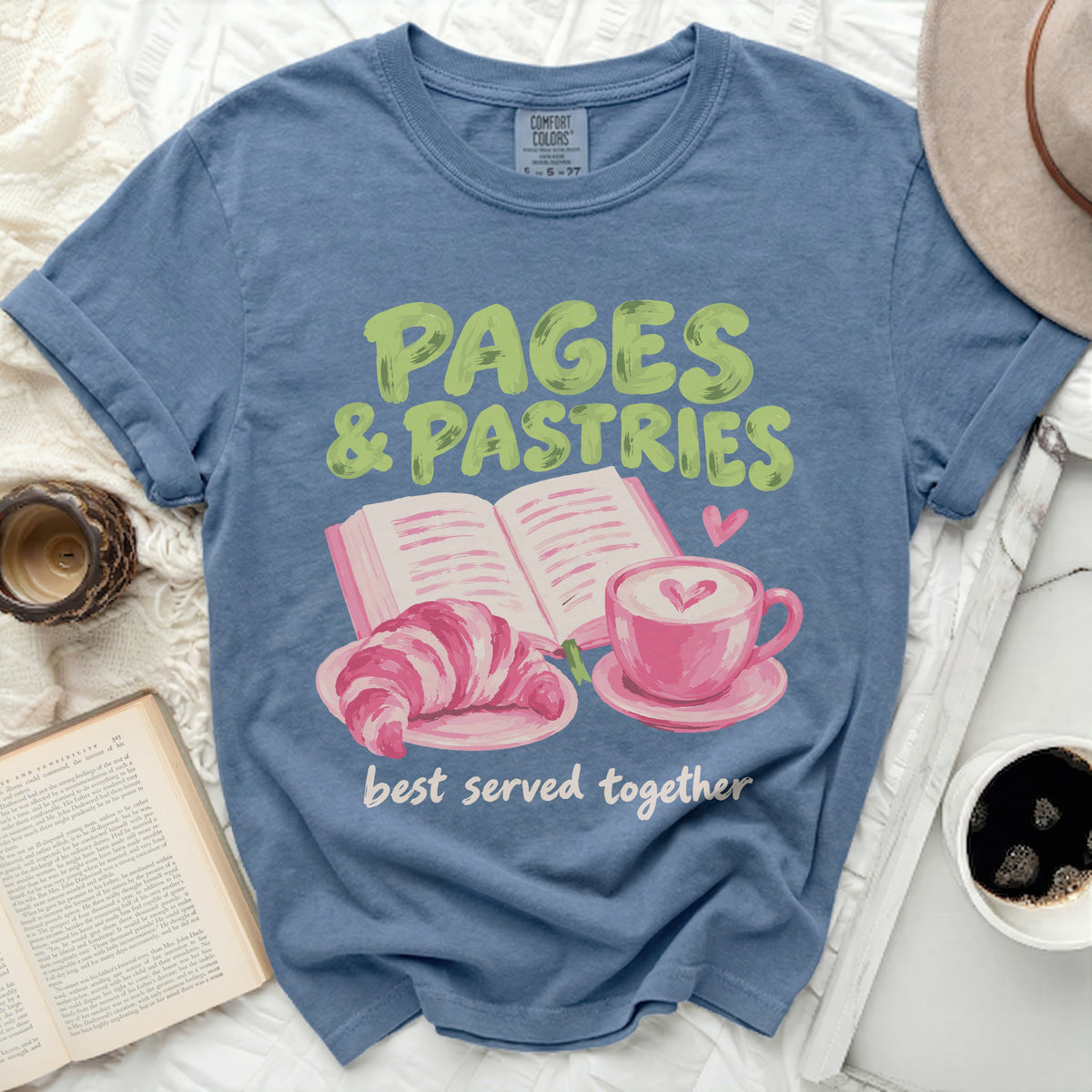 Blue t-shirt with "PAGES & PASTRIES best served together" graphic.