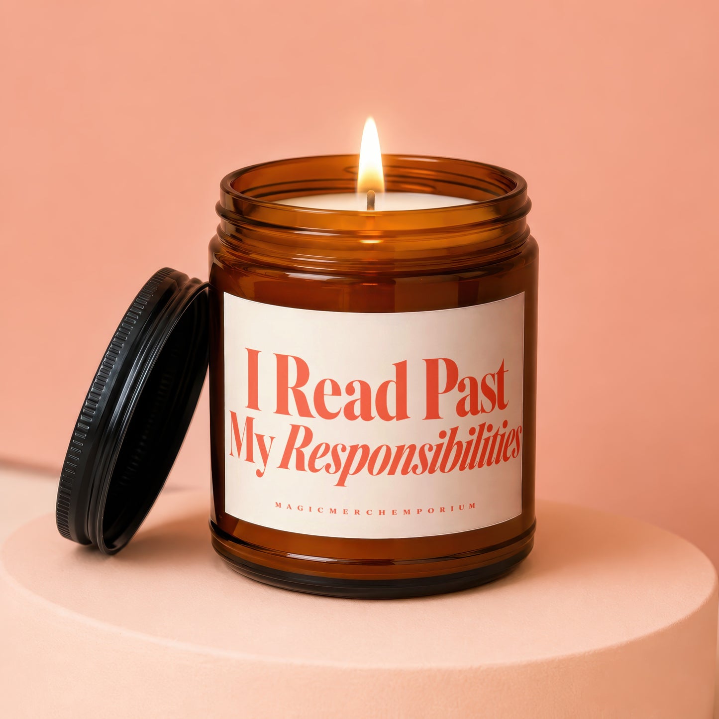 Amber jar candle with lit wick, captioned "I Read Past My Responsibilities."