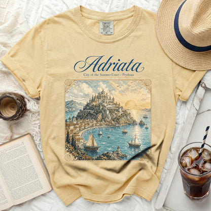 Yellow t-shirt with "Adriata City of the Summer Court" graphic of a coastal town.