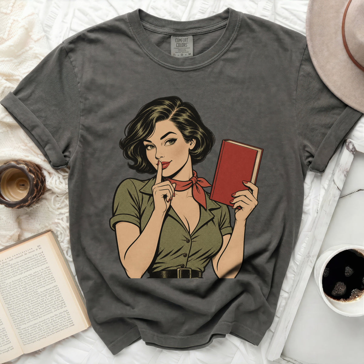 Gray t-shirt with a vintage comic book style woman holding a red book.