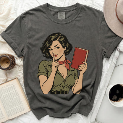 Gray t-shirt with a vintage comic book style woman holding a red book.