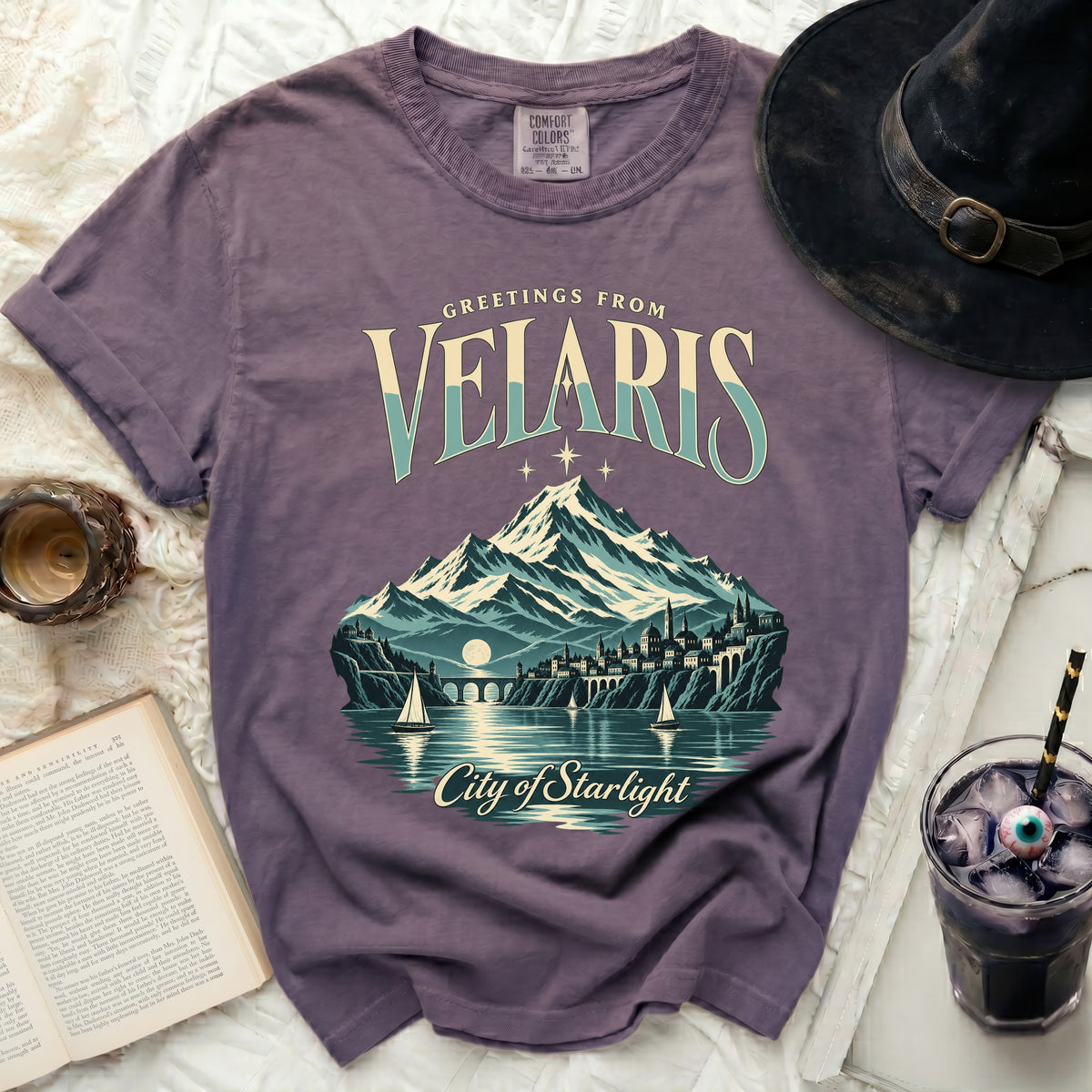 Greetings from Velaris City of Starlight t-shirt with mountains and sailboats.