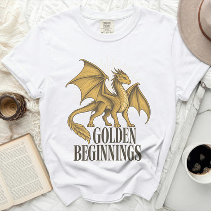 White t-shirt with golden dragon graphic and text "GOLDEN BEGINNINGS".