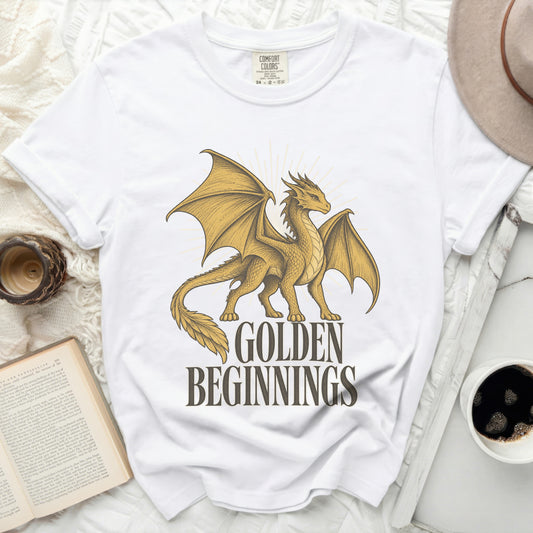 White t-shirt with golden dragon graphic and text "GOLDEN BEGINNINGS".
