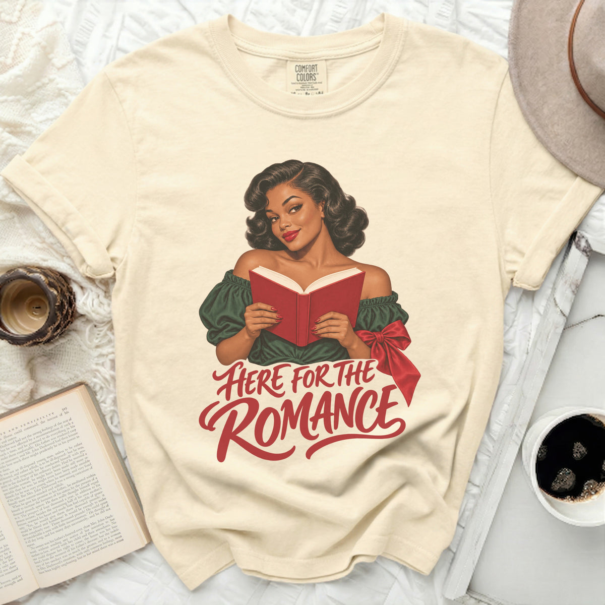 Cream t-shirt with retro woman reading red book and text "Here for the Romance".