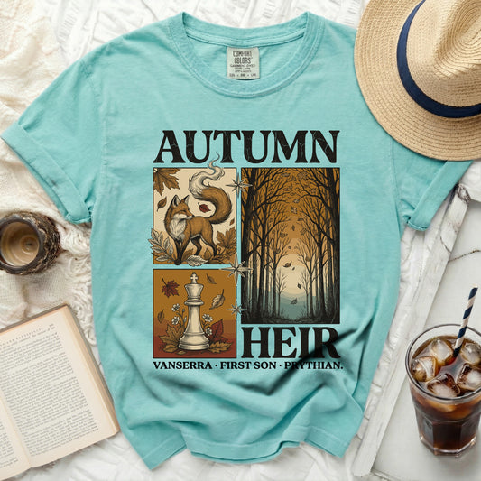 Teal t-shirt with "AUTUMN HEIR" text, featuring a fox, chess piece, and autumn forest graphic.