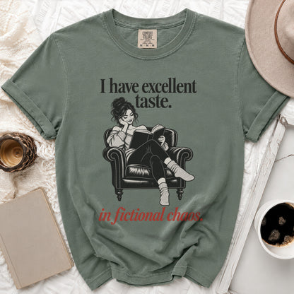 T-shirt with "I have excellent taste. in fictional chaos." text and graphic of woman reading.