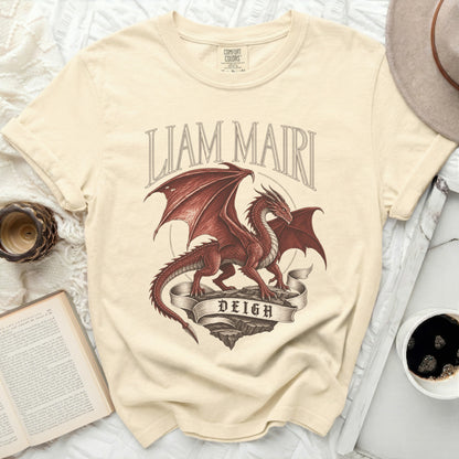 Cream t-shirt with a red dragon graphic and text "LIAM MAIRI DEIGH".