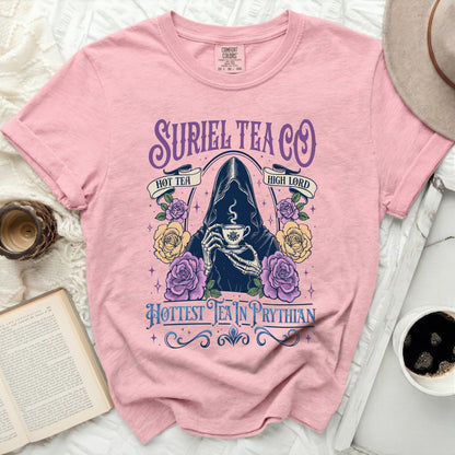 Pink t-shirt with Suriel Tea Co. Grim Reaper graphic and floral accents.