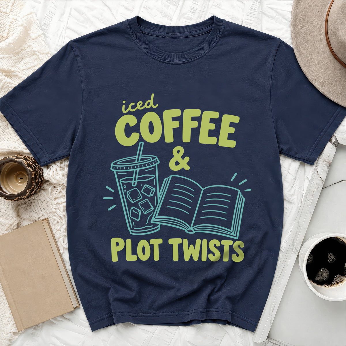 Navy t-shirt with "iced COFFEE & PLOT TWISTS" graphic and iced coffee illustration.