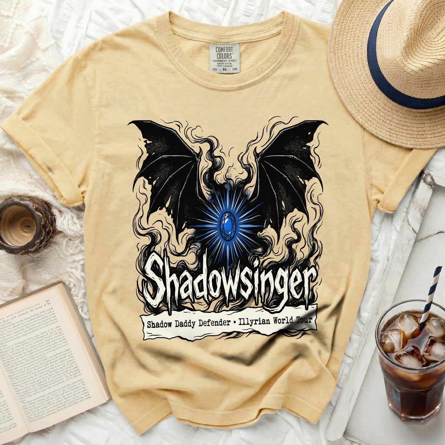 Yellow t-shirt with "Shadowsinger Shadow Daddy Defender Illyrian World Tour" graphic.