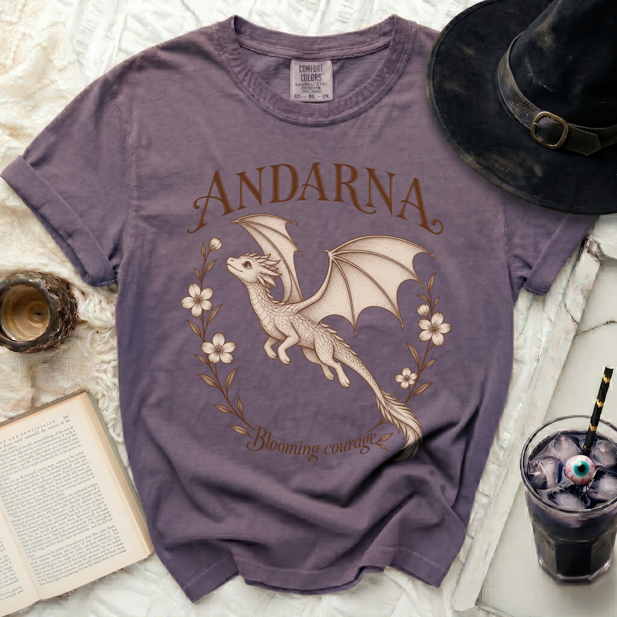 Purple t-shirt with a white dragon graphic and "ANDARNA Blooming courage" text.