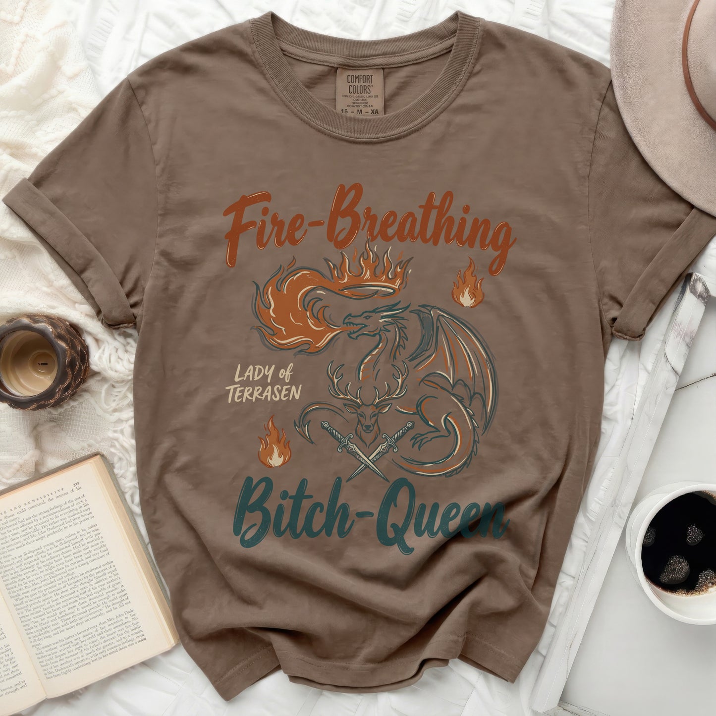 Brown t-shirt with "Fire-Breathing Lady of Terrasen Bitch-Queen" dragon graphic.